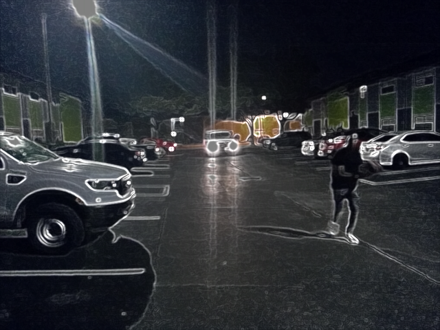 Vision Highlighter Sobel edge-detection test outlining vehicles, a pedestrian, and buildings at night